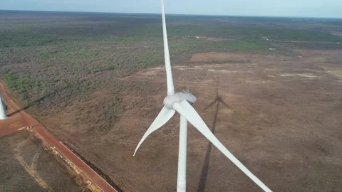 Zoom out with a fully functioning wind turbine drone, with lateral 動画素材 136553581
