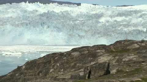 Zoom out from glacier front to a small hut in a glacier panorama Stock Footage 59999598