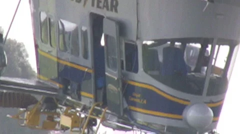 Zoom out from Good Year Blimp gondola as it moves in the wind Stock Footage 6723327