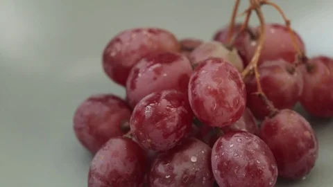 Zoom out on grapes on a grey plate Stock Footage 80375332