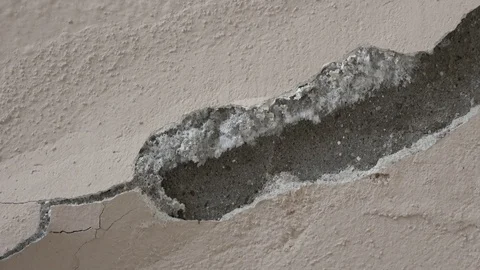 Zoom out Growing mould cracking wall plaster Stock Footage 127343023