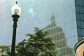Zoom out from Hancock building skyscraper next to historic building Footage