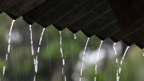 Zoom out heavy rain falling on the roof Stock Footage 80299550