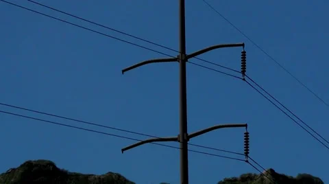 Zoom out on high-power lines in mountians Stock Footage 36246194