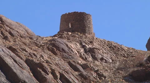 Zoom out of hillside with ancient tower atop. Ladakh, Jammu and Kashmir, India Stock Footage 55844869