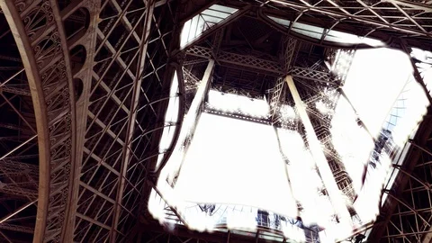 Zoom out from the inside of the historic Eiffel Tower landmark pull back 스톡 동영상 117048820