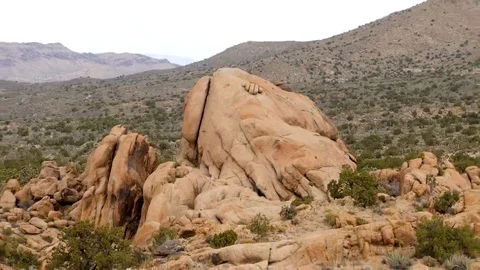Zoom Out  - Large Finger Rock in the Mojave Desert - California Stock Footage 69213985
