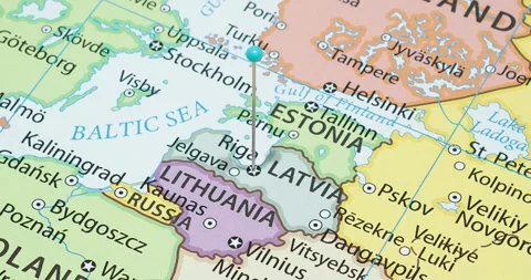 A zoom out of a light blue pin into a riga city of latvia political map 스톡 동영상 323774587