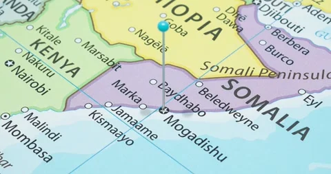 A zoom out of a light blue pin into mogadishu city of somalia political map Video stock 324822035