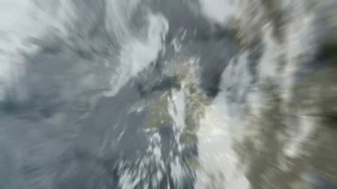 Zoom out of London, UK through clouds to see the Earth from space Stock Footage