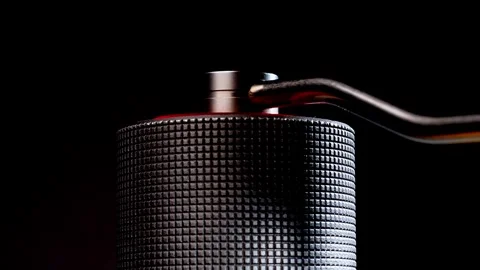 Zoom out macro of manual coffee grinder handle spinning fast. Stock Footage 323573584