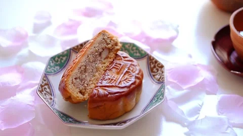 Zoom out on Mixed nuts mooncake and tea prepared for the Mid-Autumn Festival Stock Footage 320326026