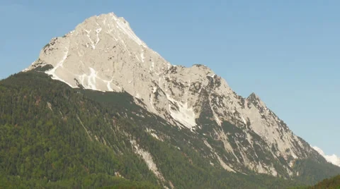 Zoom out mountaintop to typical small town in the alps with blue sky Video stock 38730794