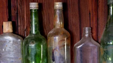 Zoom Out - Old Bottles on wall in Abandon Riley's Camp - Mojave Desert Stock Footage 69200751