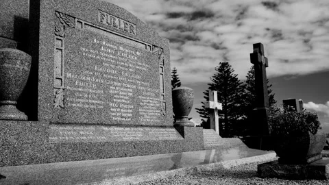Zoom out of old family plot in a cemetery in B and W 4K Stock Footage 303788802
