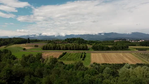 Zoom out on a panoramic view of Prealps and farmlands in Lombardy Northern Italy Stockbeeldmateriaal 247319664
