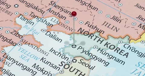 A zoom out of a red pin into pyongyang city of north korea political map Video stock 325313057