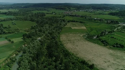Zoom out of river and fields in countryside area from drone view. 4K. Stock Footage 113204937