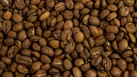 Zoom out rotating of roasted dark coffee beans. Stock Footage 138359734