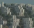 Zoom out from rows of white houses on hillside SD Footage