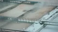 Zoom out sewage treatment tanks with foam over surface HD Footage