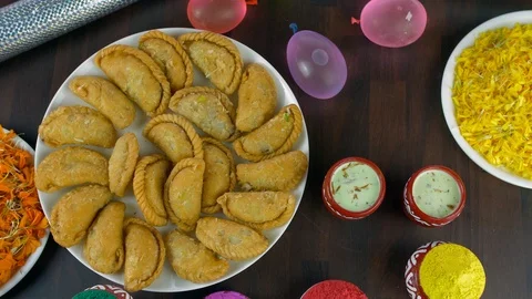 Zoom out shot of a decorated table for the joyful Holi festival celebrated in... Stock Footage 125232090
