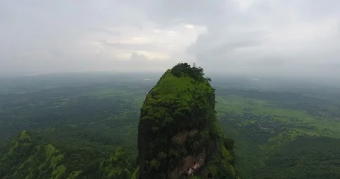 Zoom out shot of the structure on top of mountain to reveal the mountain Stock Footage 117094521
