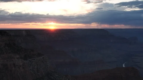 Zoom out shot of the sun setting from hopi point in grand canyon Stock Footage 121736635
