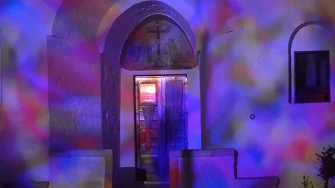 Zoom out shot of Trullo Sovrano in Alberobello Italy at night Stock Footage 89779161