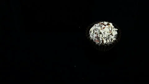 Zoom out from Single Chocolate Candy with Crushed Nuts Stock Footage 104566299