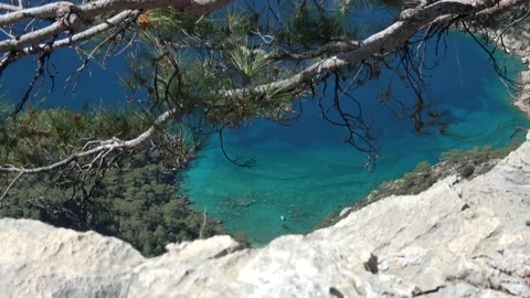Zoom out a small boat in turquoise water high-angle viewed from above Stock Footage 333464754