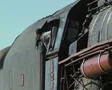 Zoom out from stationary steam train starting to move SD Footage