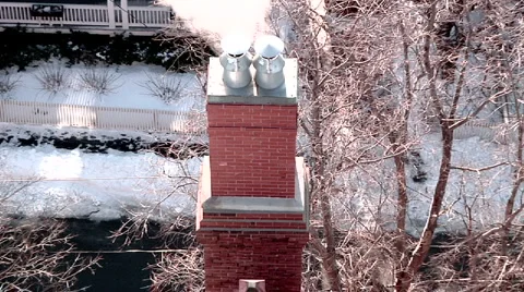 Zoom Out From Steaming Chimney Stock Footage 888553
