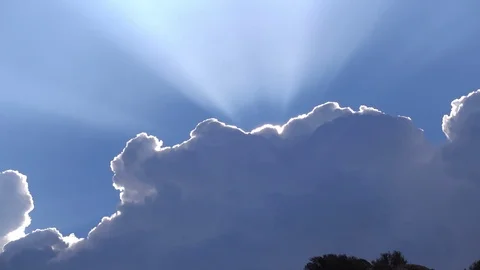 Zoom out sun rays clouds and mountains Stock Footage 73934620