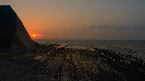 Zoom out sunset at the sea cliffs Stock Footage 112295703