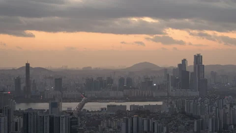 Zoom out sunset time lapse of Seoul city skyline at sunset view from Namsan N Stock Footage 228972223