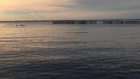 Zoom out time lapse of beach in the evening Stock Footage 79979146