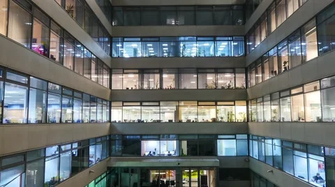 Zoom out Time lapse of busy city office workers together in large modern office Stock Footage