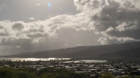 Zoom out time lapse as clouds pass over town on east side of Oahu, Hawaii Stock Footage 49909653