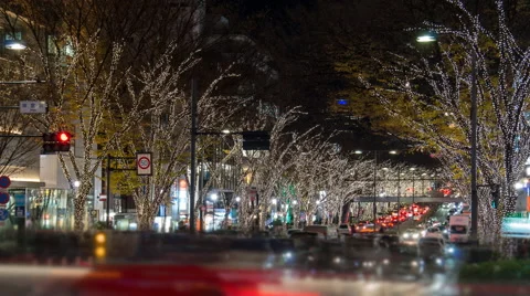 Zoom out time lapse of holiday traffic, shoppers, and decorations in Omotesando Stock Footage 50503628