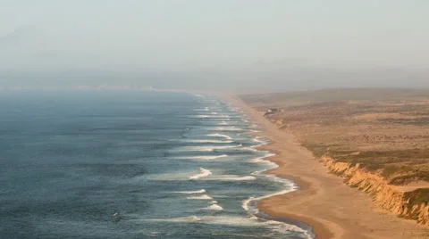 Zoom out time lapse of waves on a beach in California from above camer Video stock 49413501