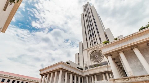 Zoom out timelapse of CL Building at Assumption University against cloudy sky Video stock 113349270