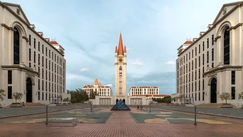Zoom out Timelapse of Clock tower at ABAC being illuminated during sunrise Stock Footage 111165751