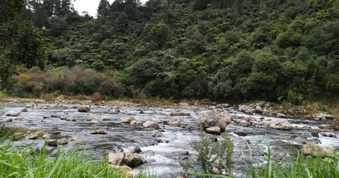 Zoom out tracking shot of river in slow motion Stock Footage 90088247