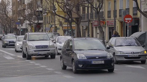 Zoom Out of Traffic Driving down Busy Street  - Valencia Spain Stock Footage 73312226