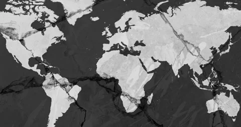 A zoom out video with a grey world map over a dark grey cracked wall Stock Footage 337432780