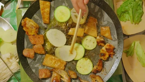 Zoom-out view of communal grill meal. Stock Footage 328617413