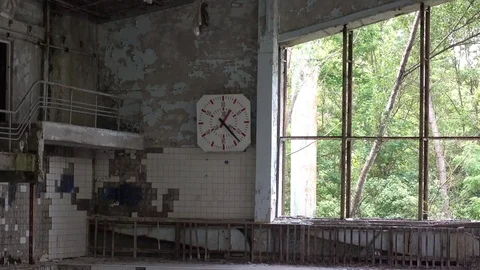 Zoom out wall clock in the Pripyat swimming pool Stock Footage 78487236