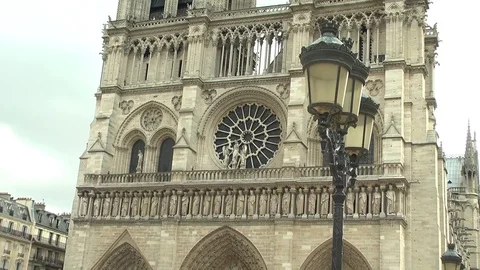 Zoom out of western facade of Notre Dame Cathedral, Paris, France Stock Footage 106779986