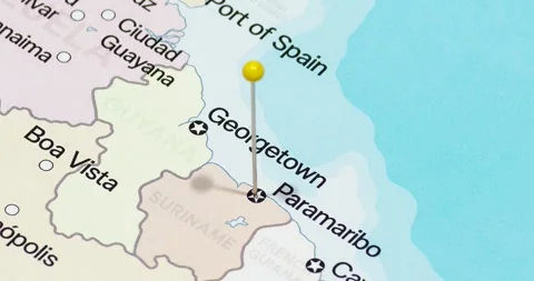 A zoom out of a yellow pin into Paramaribo city of Suriname political map Stockbeeldmateriaal 323774277